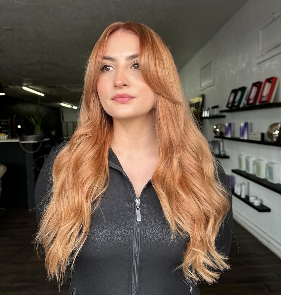 Warm copper tones on long hair, perfect for fall hair colors inspiration.