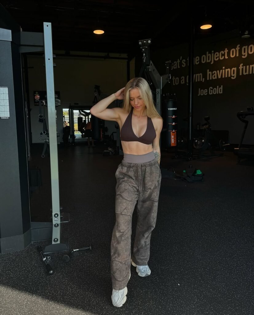 Gym outfit inspo with a dark brown halter sports bra and loose joggers, perfect for a relaxed workout vibe.