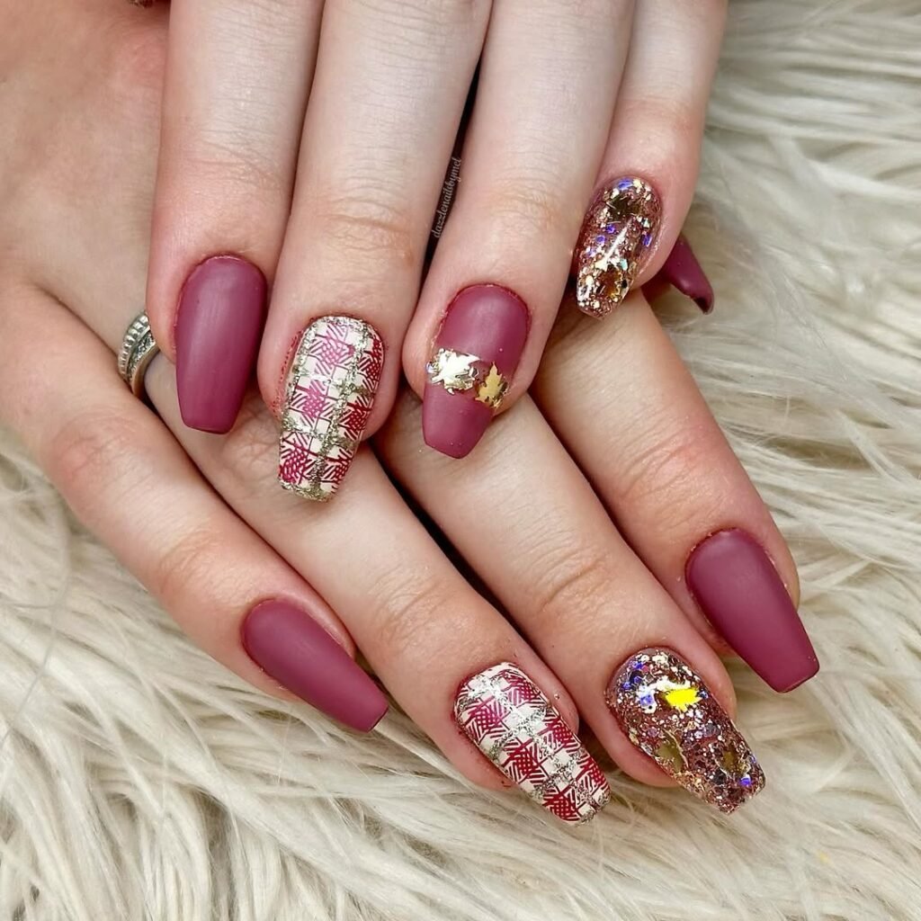 Fall Nail Colors with matte burgundy polish, gold foil, and plaid accent nails.