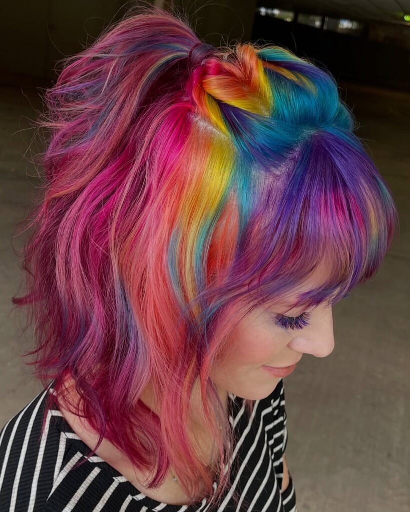 Vibrant rainbow half-up twist on short layered hair – cute hairstyles for short hair.