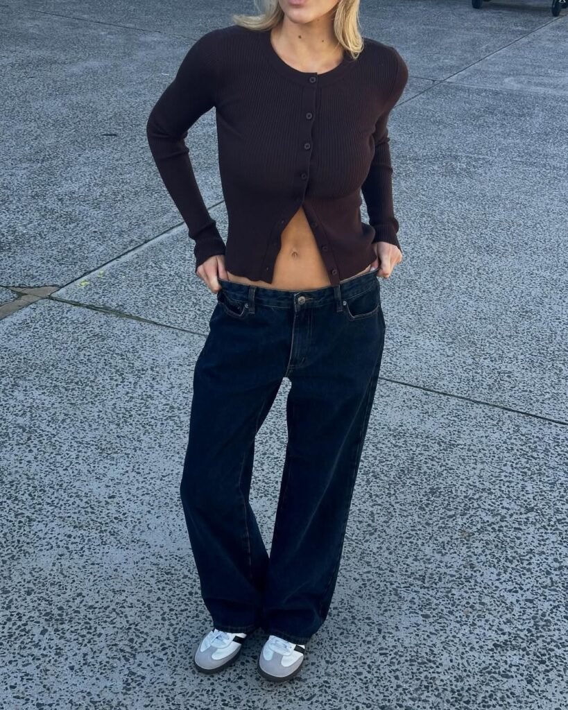 Cozy brown cardigan outfit paired with wide-leg dark jeans and sneakers.

