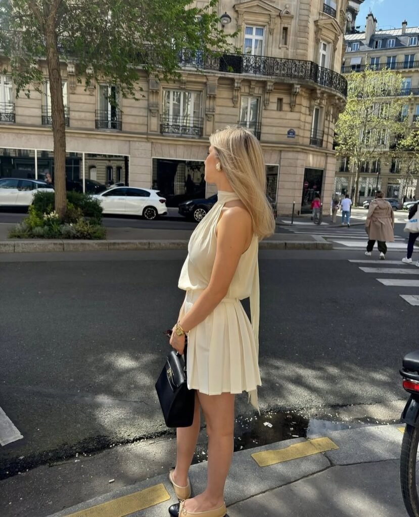 Feminine and stylish work outfit with a flowy cream dress, perfect for warm-weather offices.