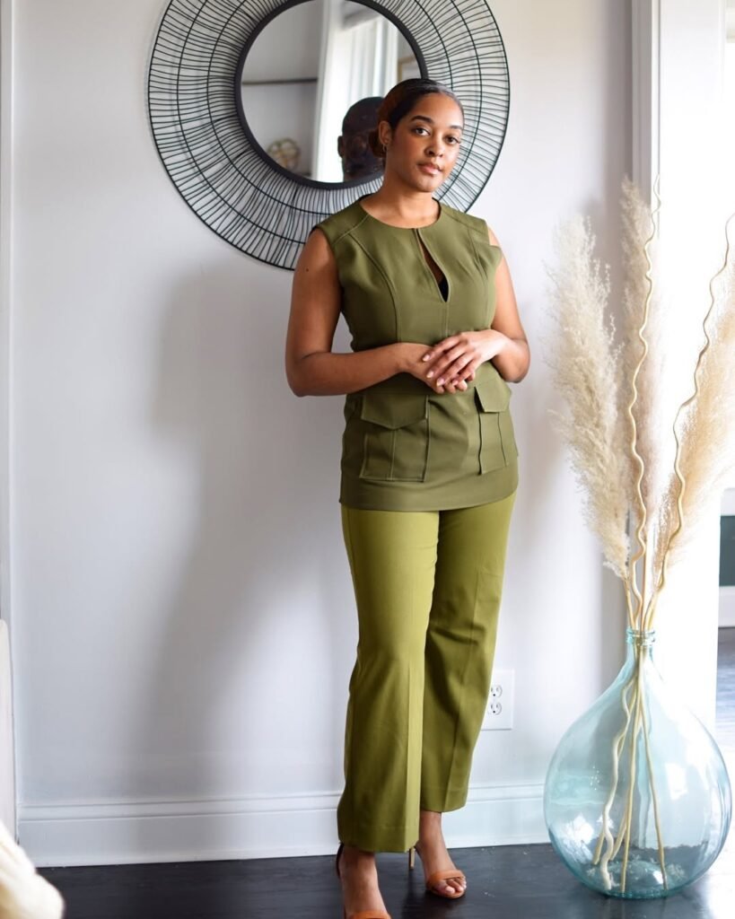 Stylish work attire in monochrome olive green—sleeveless structured top with matching trousers, perfect for a modern and polished professional look.