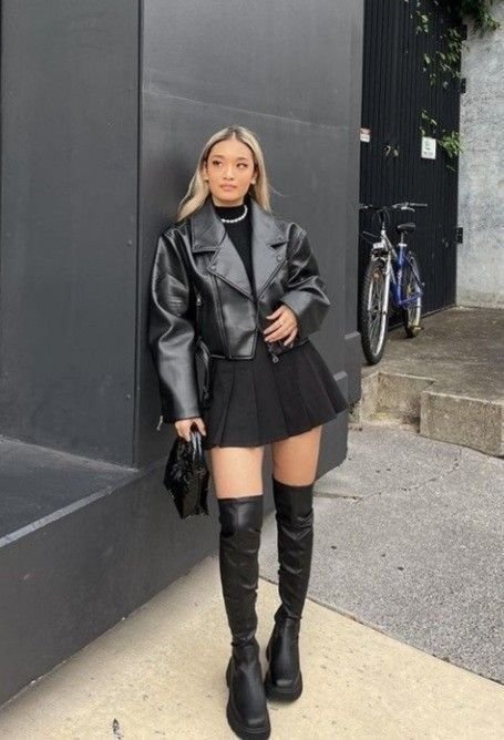 Trendy street-style Leather Blazer outfit featuring a cropped jacket, black mini skirt, and over-the-knee boots.