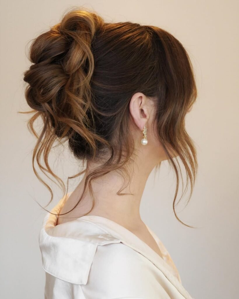 High updo with curls – voluminous elegant hairstyle for special occasions.