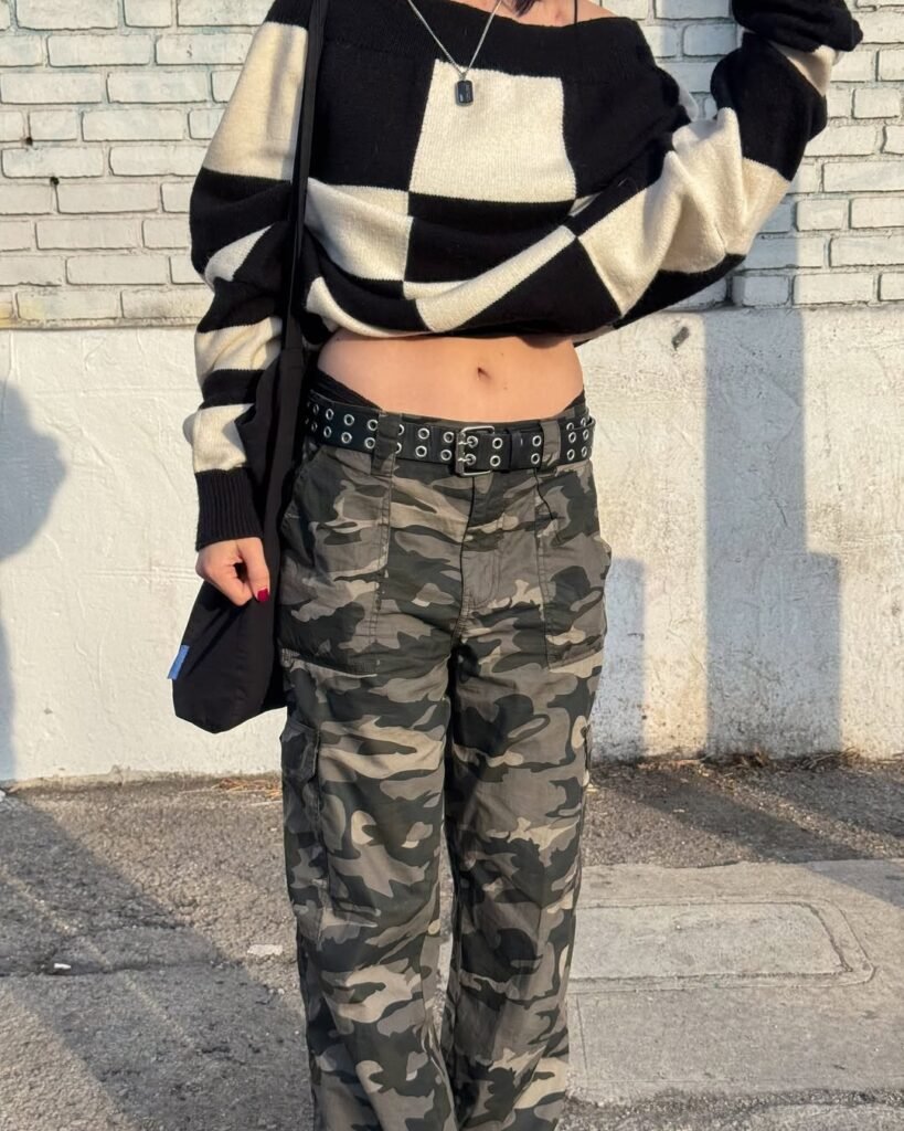 Urban Camouflage Pants Outfit featuring a black and white oversized sweater with low-rise camo cargo pants and a grommet belt.