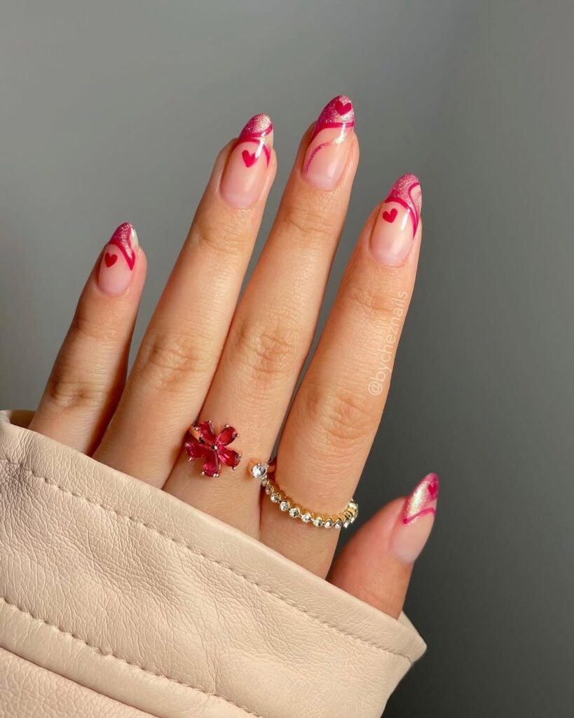 Vibrant pink glitter swirl and heart nail ideas perfect for a playful and romantic manicure.
