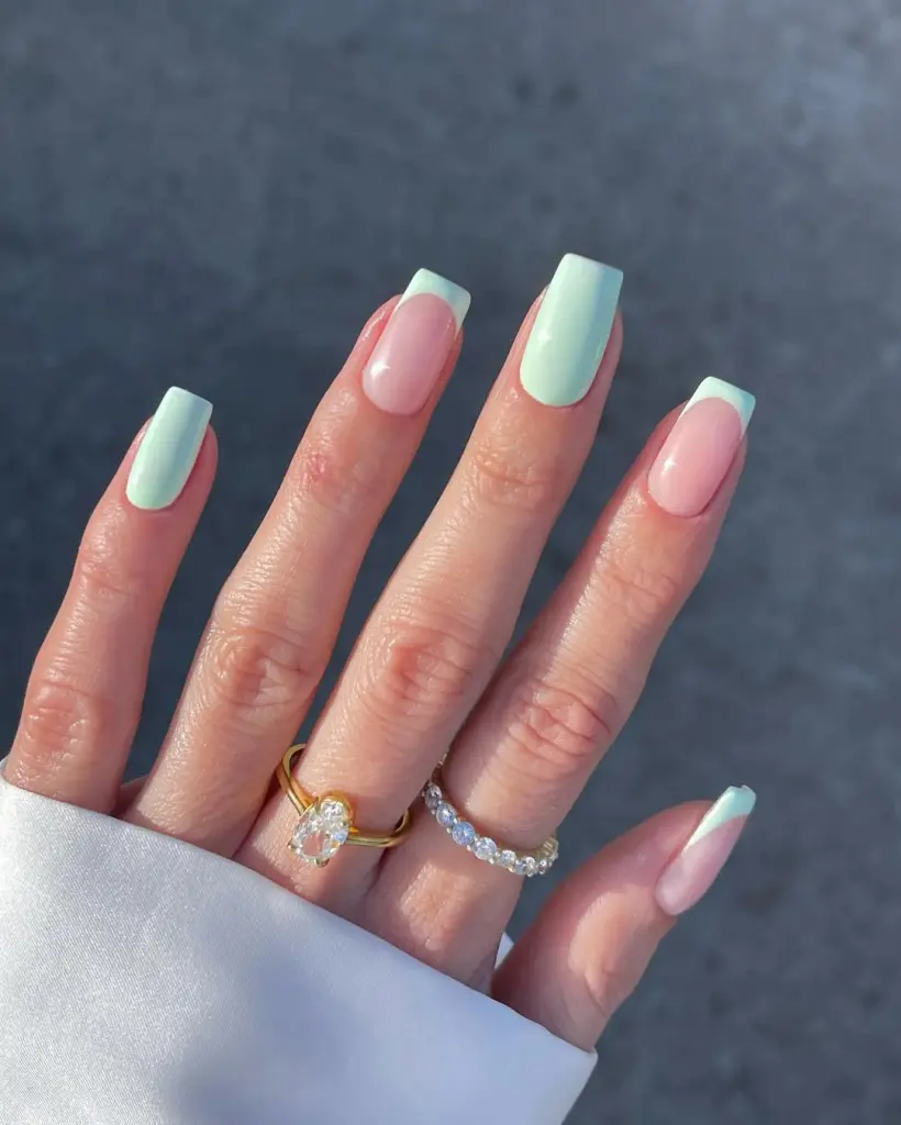 Spring Nail Ideas with mint green and nude French tips, blending pastel hues into a trendy spring color palette.