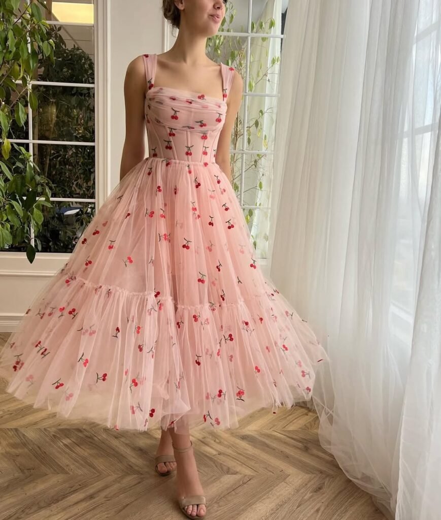 Woman in gray denim Bermuda shorts and a gray tank top with a woven net tote, styled for summer but not typically modest.