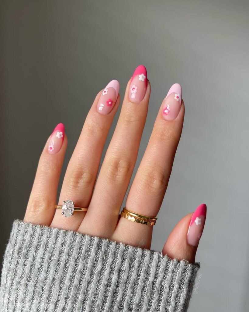 Spring Nail Ideas in hot pink and soft pink French tips with tiny white and pink floral art.