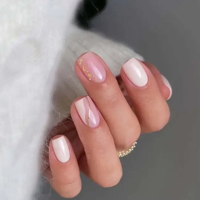 Classy short nail ideas with white tips and delicate gold accents for a sophisticated finish.