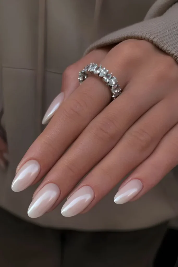 White Summer Nails with a sleek, glossy finish and almond-shaped tips for an elegant minimalist look.