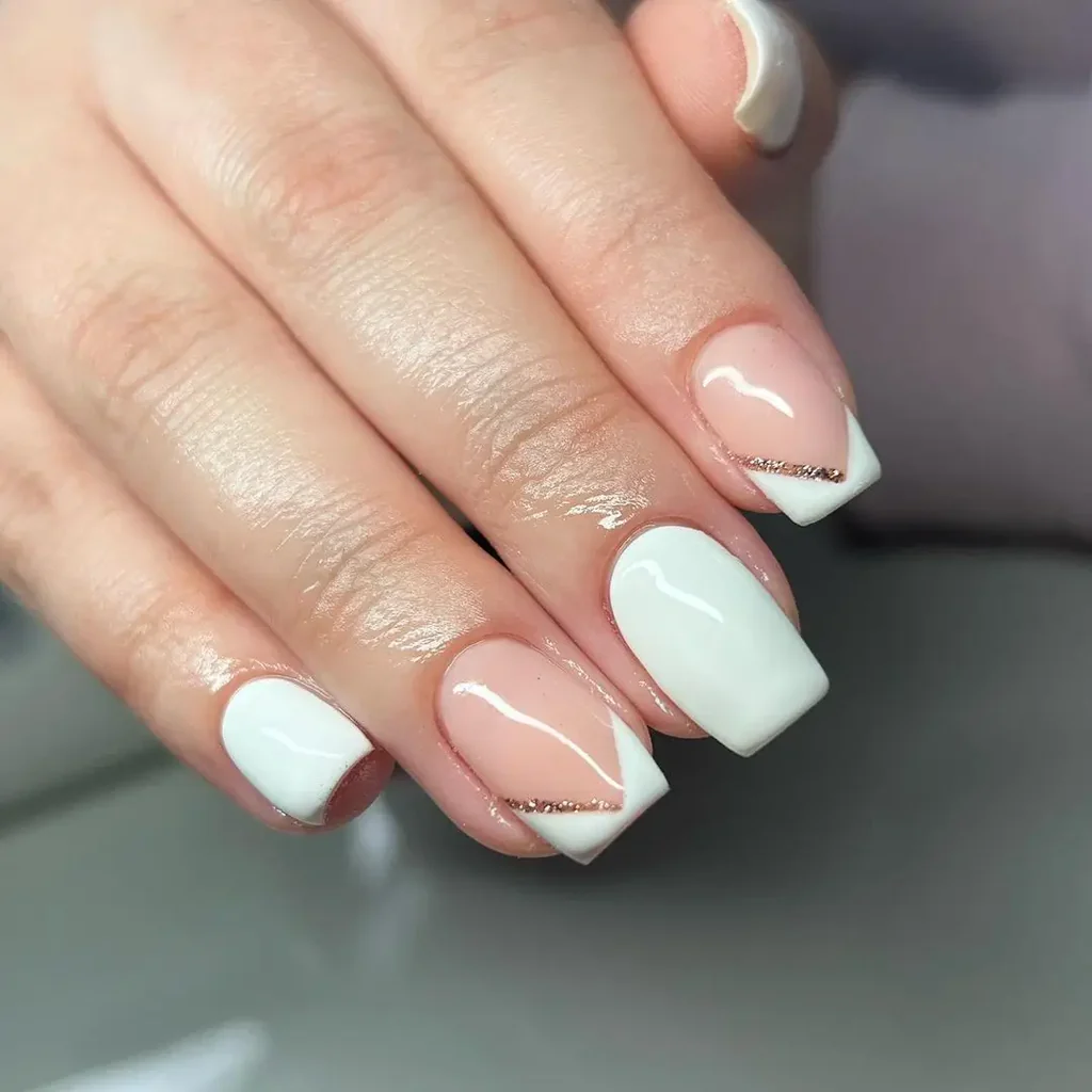 White Summer Nails featuring square tips with a chic French design and subtle nude and gold accent lines.