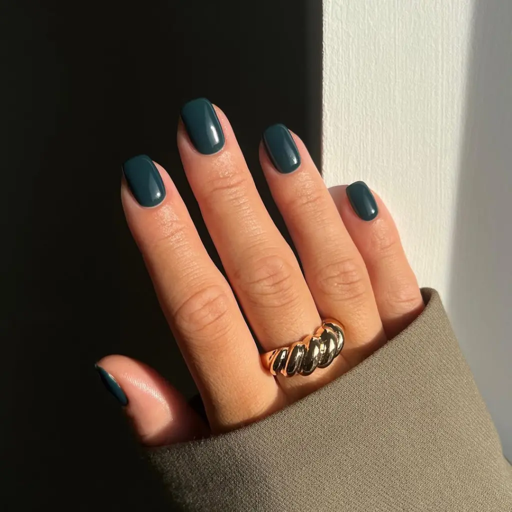 Short fall nail designs with solid deep teal glossy polish.