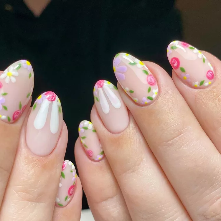 Floral and feminine Stunning Nail Ideas with a mix of daisy tips and multicolored blossoms, designed on a glossy nude background.