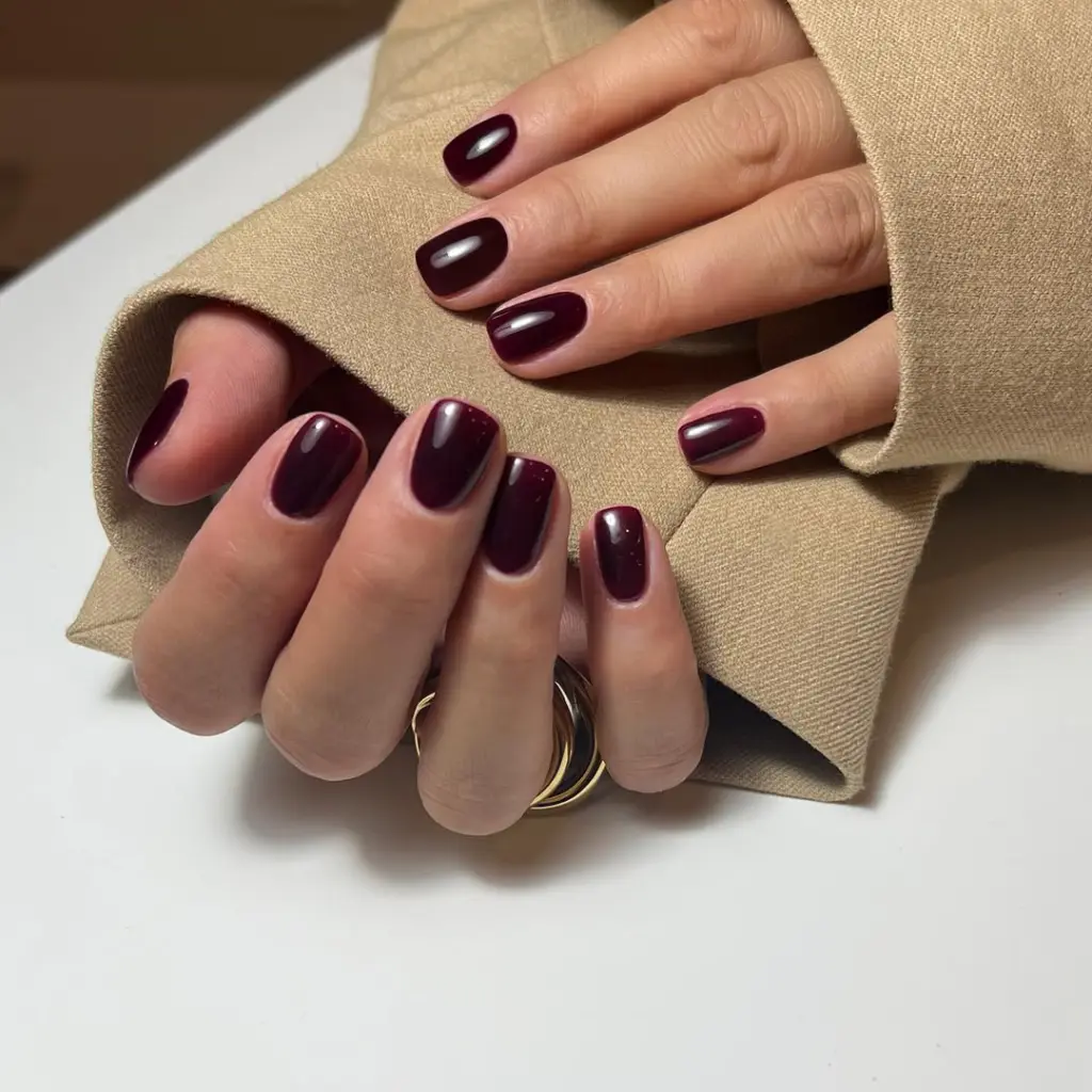 Short fall nail designs with glossy deep burgundy polish.