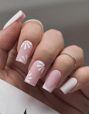 White Summer Nails in a matte finish with pink base and daisy flower art, giving a fresh and feminine touch.