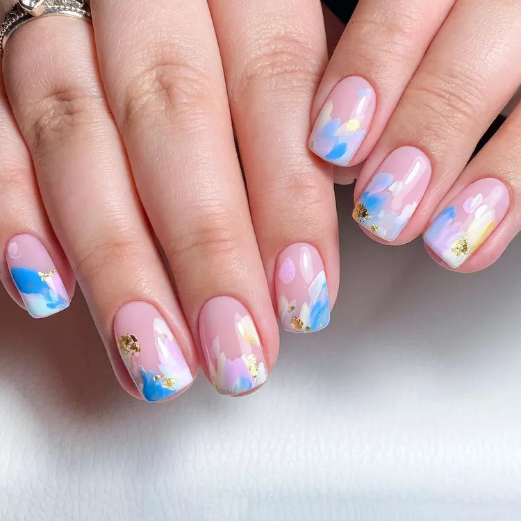 Abstract watercolor Stunning Nail Ideas with pastel brushstrokes in blue, pink, and gold accents, giving a painterly, artistic finish.