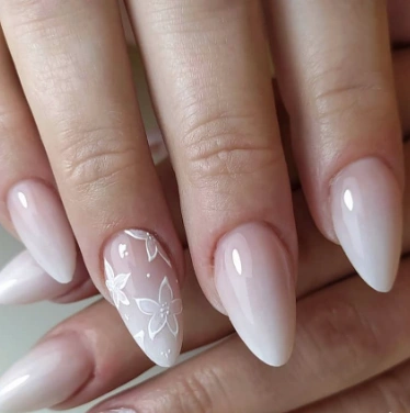 White Summer Nails with a soft gradient and subtle white floral design, perfect for a romantic summer aesthetic.