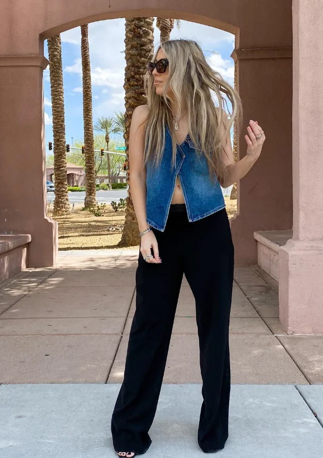 A cute simple outfit with a denim vest top and wide-leg black pants, completed with oversized sunglasses for a stylishly laid-back appearance.