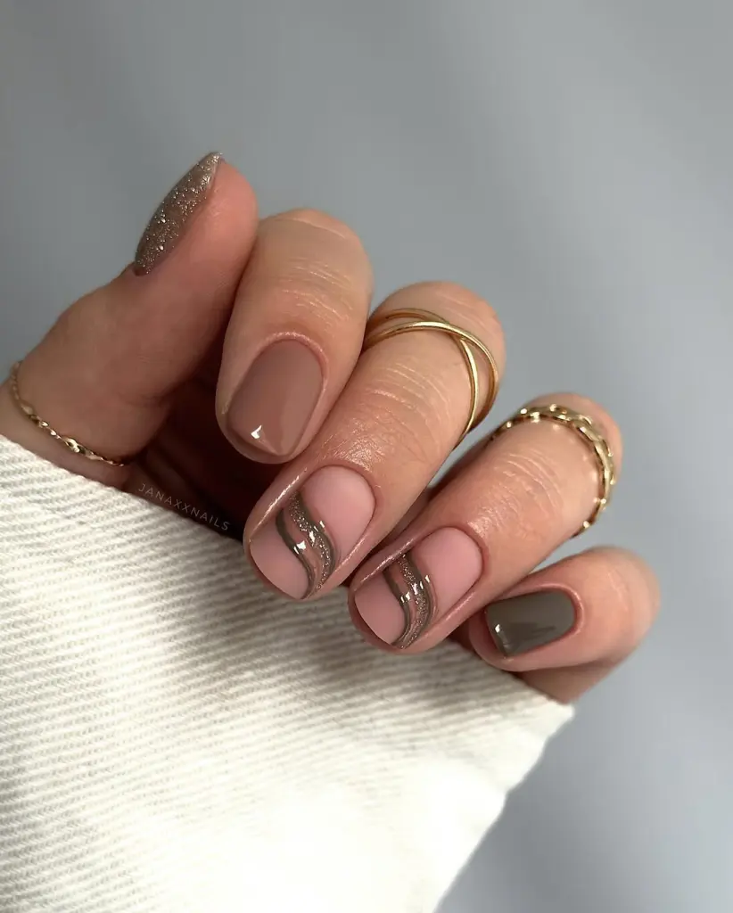 Short fall nail designs with nude polish and metallic silver wave accents.