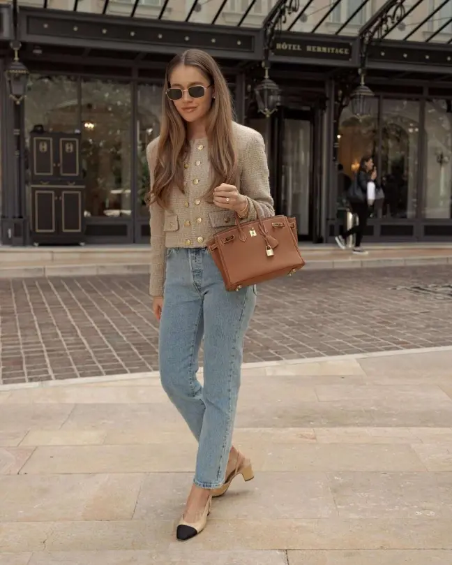 Tweed jacket with gold buttons, straight-leg jeans, and beige slingbacks — a refined old money spring outfit.