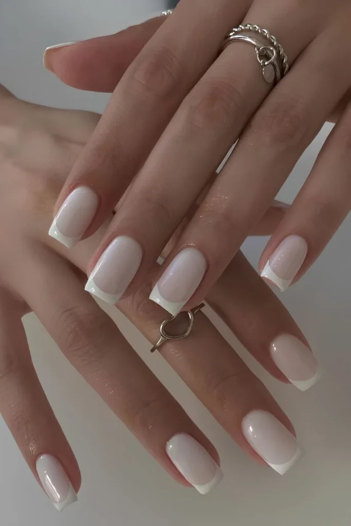 Classic French tip White Summer Nails with a squared shape and glossy finish, ideal for understated elegance.