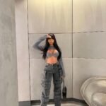 Bold cargo pants outfit with grey cargo pants and a statement cutout top.