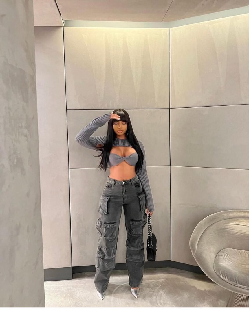 Bold cargo pants outfit with grey cargo pants and a statement cutout top.
