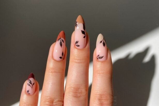 Chic minimalist Fall Nail Colors with leaf accents and gradient French tips in neutral tones.