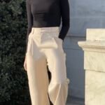 Simple yet stylish Beige Palazzo Pants Outfit featuring a black turtleneck and chunky shoes for a modern minimalist statement.