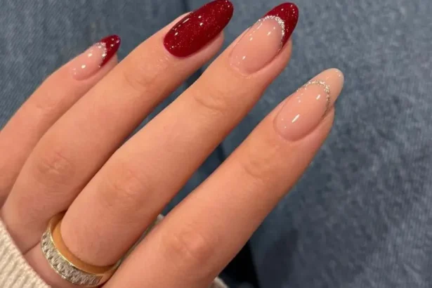 Sparkly red and nude almond-shaped nail ideas with glitter accents for a festive glam look.