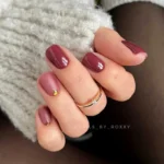 Short fall nail designs with mauve tones and gold foil accents.